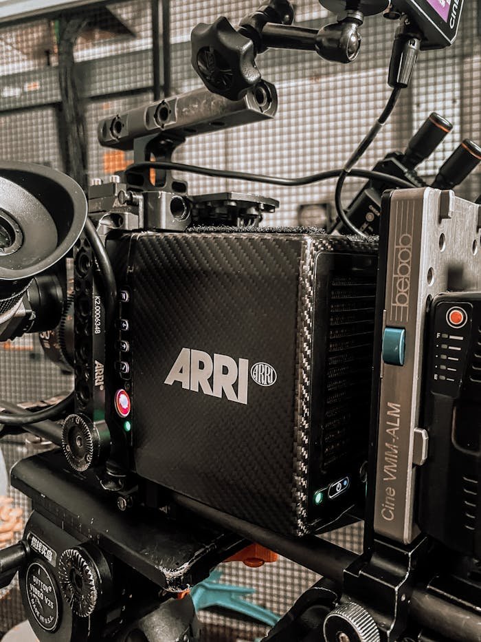 Servicios contenido audiovisual Tarragona. Close-up of a professional ARRI camera rigged for filming in a modern studio.